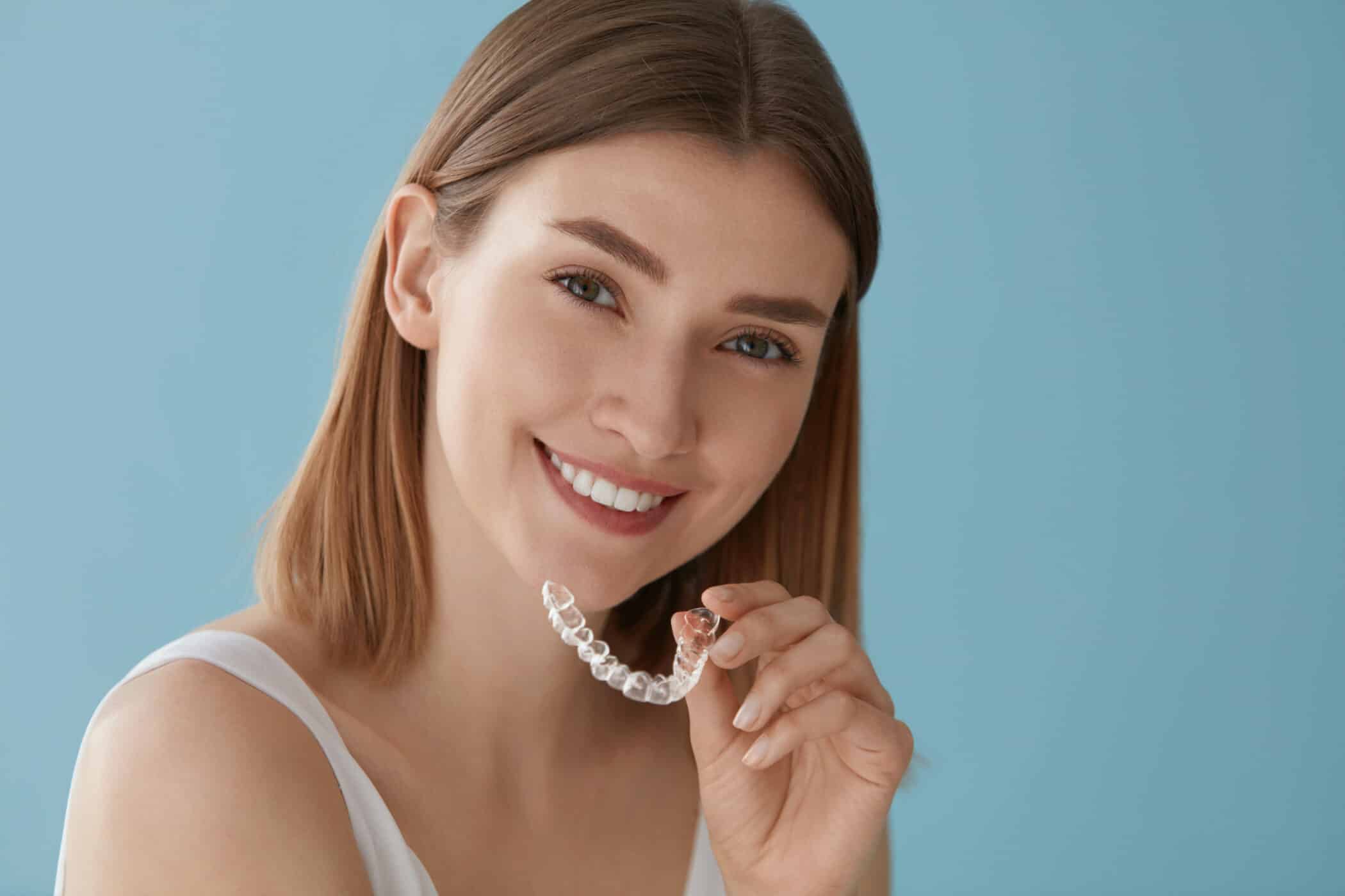 Woman using invisalign clear braces