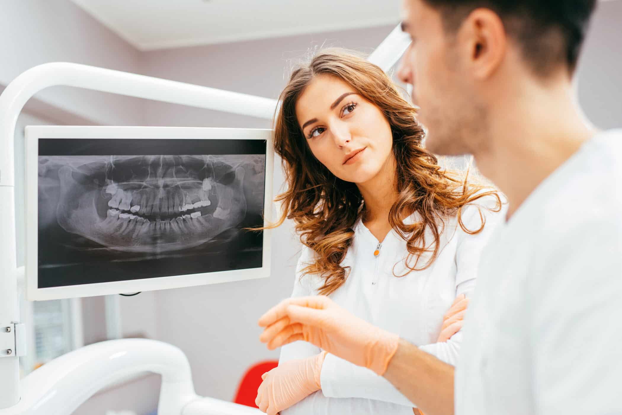 Dentist looking at a dental x-ray